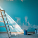 sunlit-room-with-blue-walls-ladder-painting-supplies_97843-77930